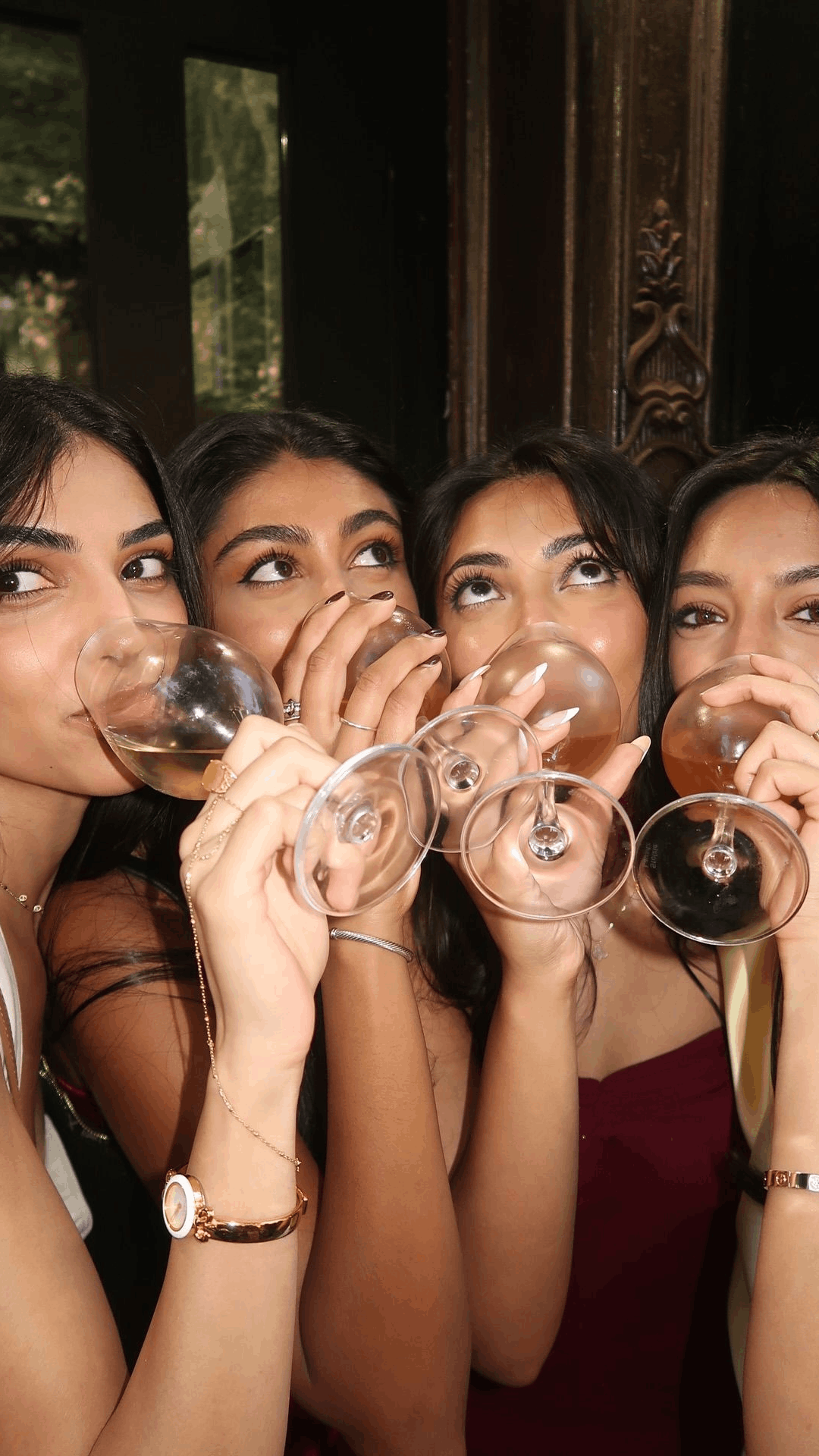 Friends raising glasses on a night out